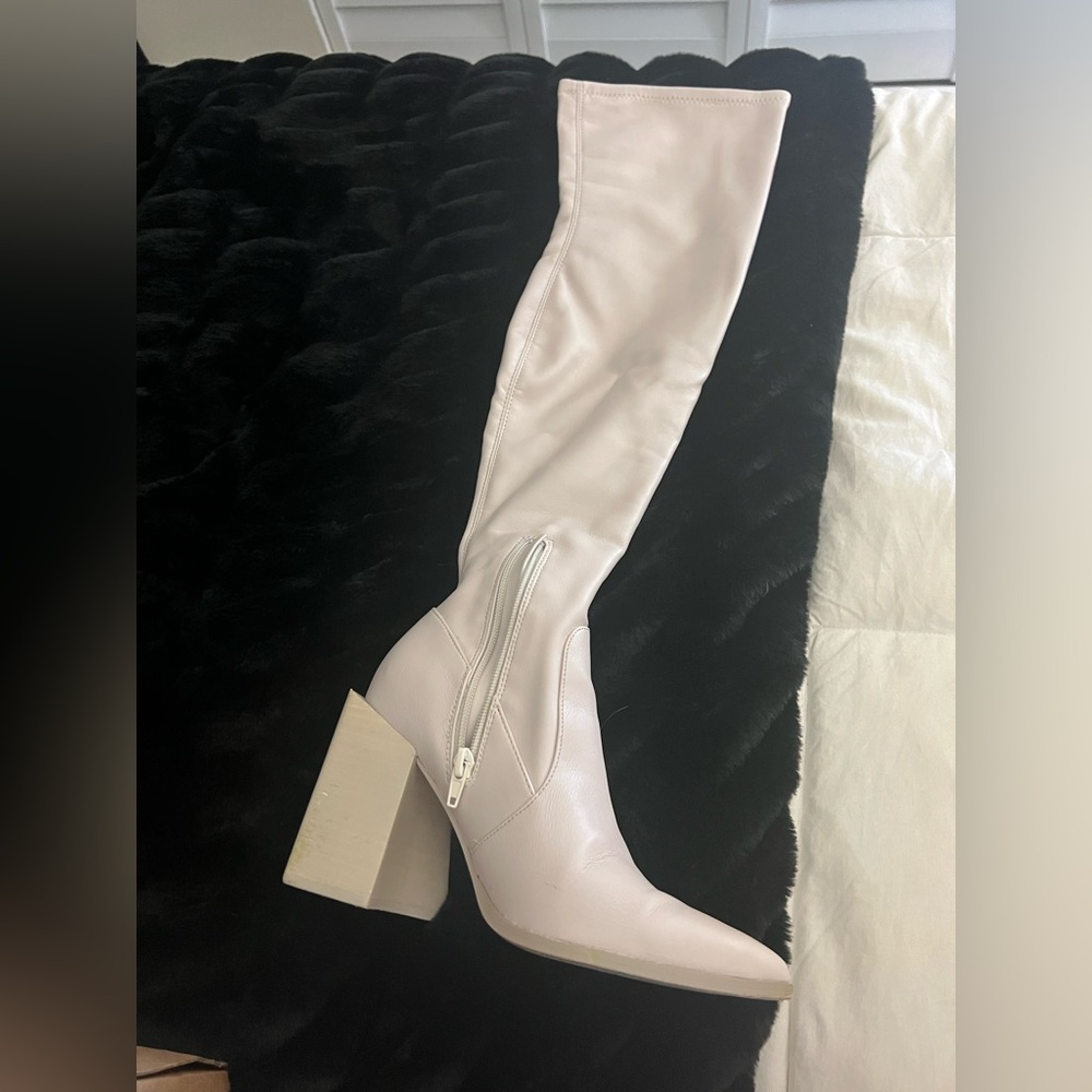 Knee-High Boots
Steve Madden 
I am a 6.5 and the 7.0 fits me perfect